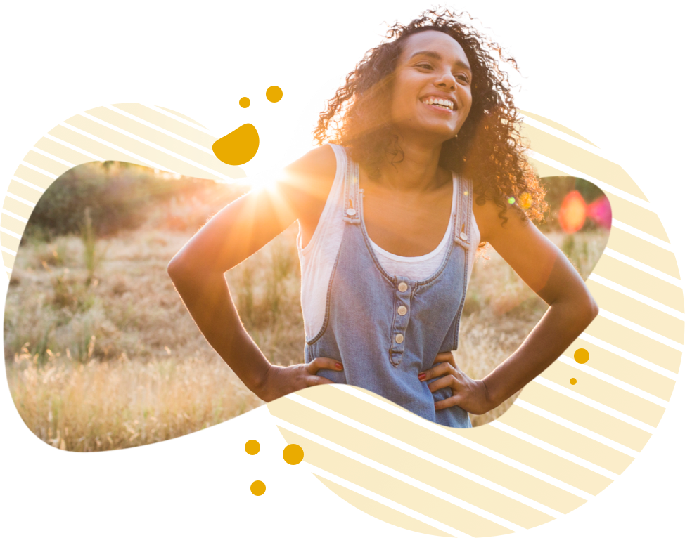 Woman smiling in the sunlight Woman smiling with sunlight in the background